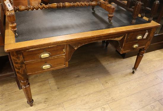 An oak writing table W.153cm